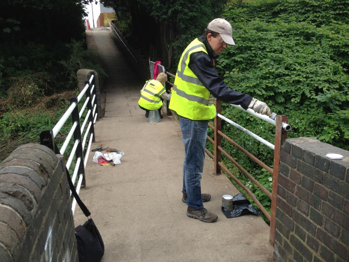 Volunteers painting the footbridge over the canal in August 2015 Volunteers painting the footbridge over the canal in August 2015